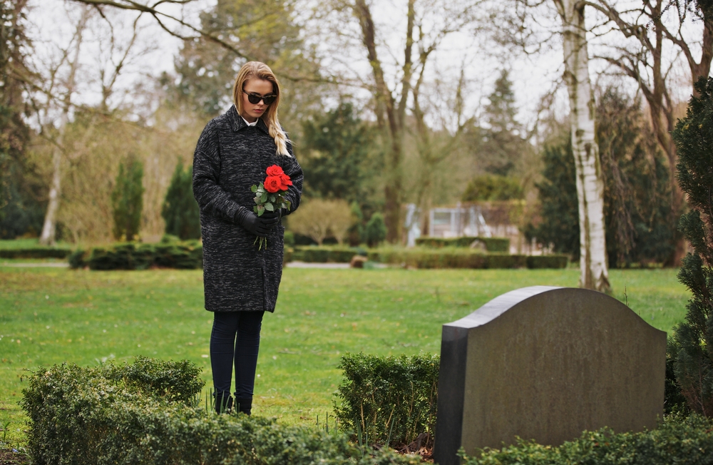 grieving, at a gravesite.jpg